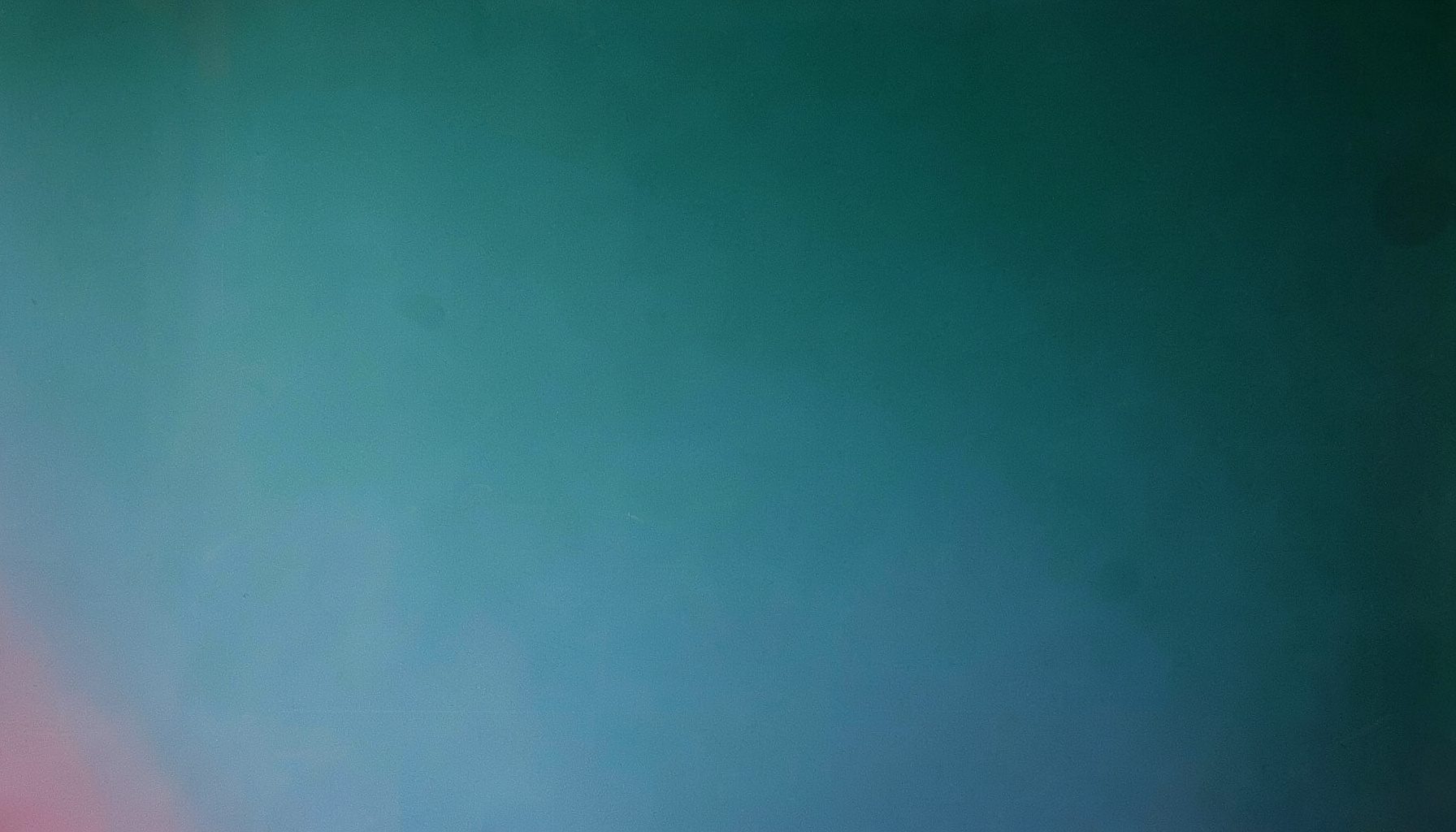 A calm abstract gradient panel in deep teal and soft blue, evoking a quiet, informative workspace without people or text.